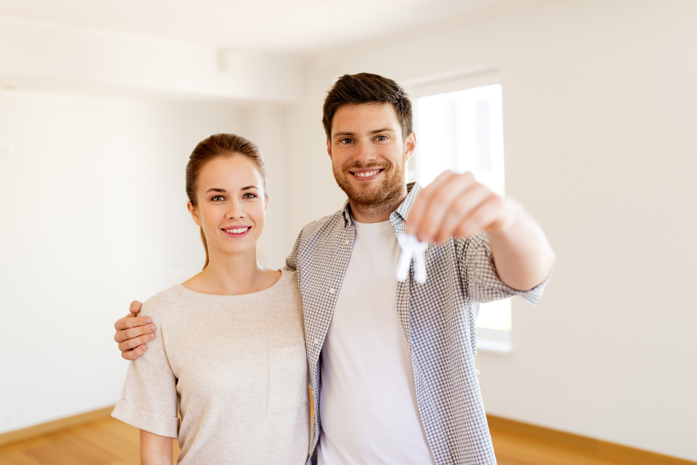 Happy Couple with Keys of New Home